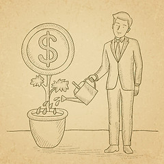 Image showing Man watering money flower.