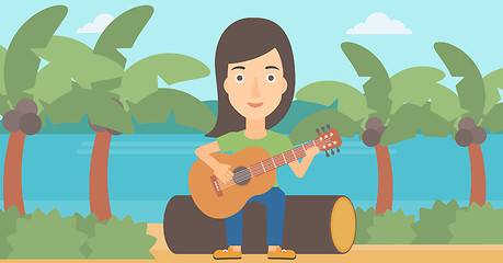 Image showing Woman playing guitar.