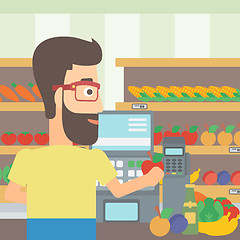 Image showing Cashier at supermarket checkout.