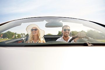 Image showing happy man and woman driving in cabriolet car