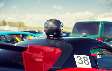 Image showing close up of car with helmet on roof top