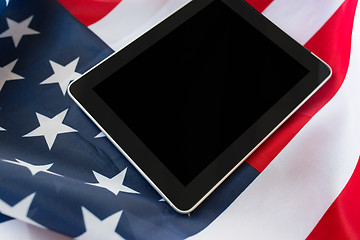 Image showing close up of tablet pc computer on american flag