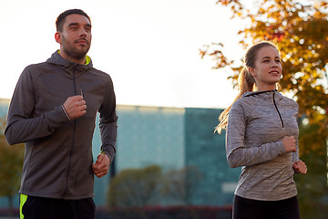 Image showing couple running outdoors