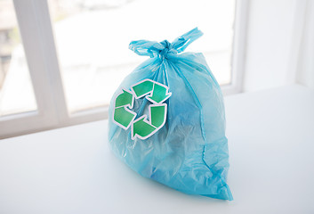 Image showing close up of rubbish bag with green recycle symbol