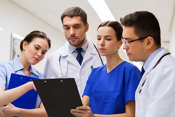 Image showing group of medics with clipboards at hospital