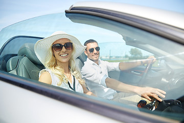 Image showing happy man and woman driving in cabriolet car