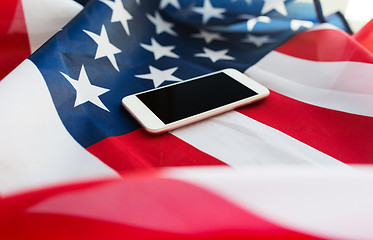 Image showing close up of smartphone on american flag