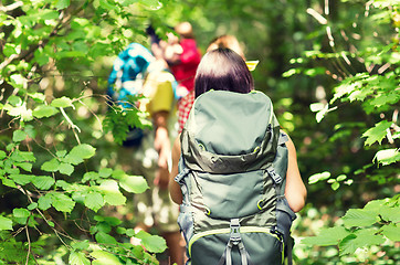 Image showing close up of friends with backpacks hiking