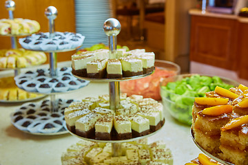 Image showing Dessert table for party. akes and sweetness. Shallow dof