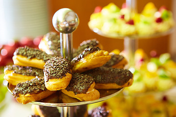 Image showing Dessert table for party. akes and sweetness. Shallow dof