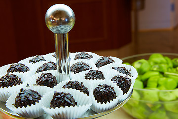 Image showing Dessert table for party. akes and sweetness. Shallow dof