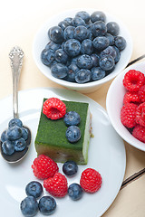 Image showing green tea matcha mousse cake with berries