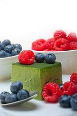 Image showing green tea matcha mousse cake with berries