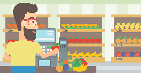 Image showing Cashier at supermarket checkout.