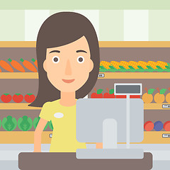 Image showing Saleslady standing at checkout.