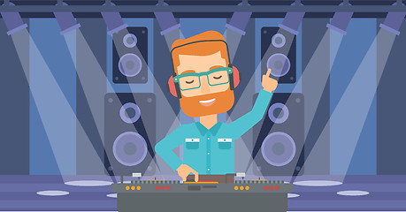 Image showing Smiling DJ with console.