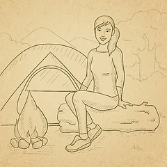 Image showing Woman sitting at camp.