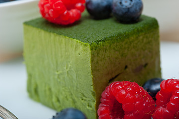 Image showing green tea matcha mousse cake with berries