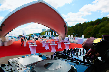 Image showing Dj hands on equipment