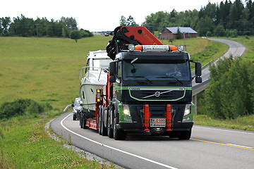 Image showing Volvo FM Semi Boat Transport on Rural Road