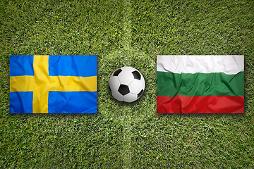 Image showing Sweden vs. Bulgaria flags on soccer field