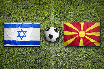 Image showing Israel vs. Macedonia flags on soccer field