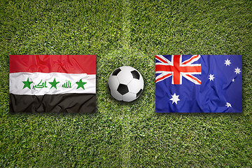 Image showing Iraq vs. Australia flags on soccer field