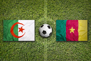 Image showing Algeria vs. Cameroon flags on soccer field