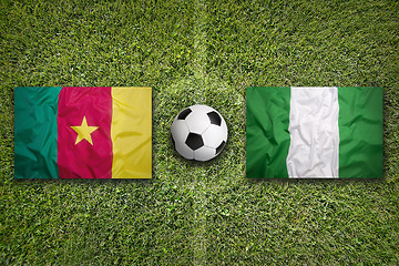 Image showing Cameroon vs. Nigeria flags on soccer field