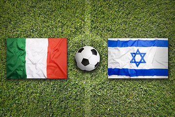 Image showing Italy vs. Israel flags on soccer field