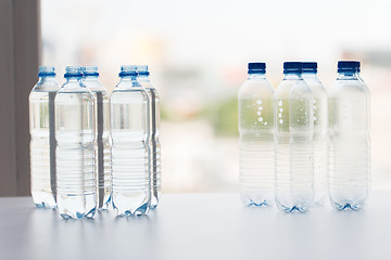 Image showing close up of bottles with drinking water on table