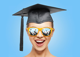 Image showing happy teenage girl in shades and mortarboard hat