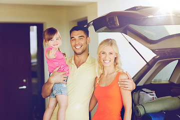 Image showing happy family with hatchback car at home parking