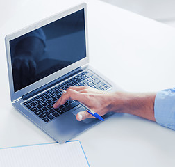 Image showing miling businessman working in office