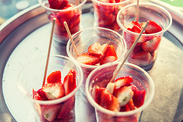 Image showing strawberry in plastic cups at street market