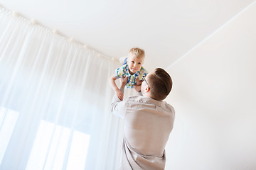 Image showing father with son playing and having fun at home