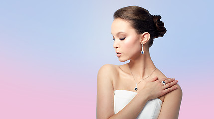 Image showing beautiful woman with earring, ring and pendant