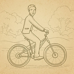 Image showing Man riding bicycle.