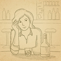 Image showing Woman sitting at bar.