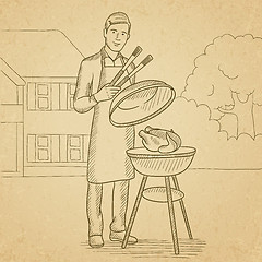 Image showing Man preparing barbecue.