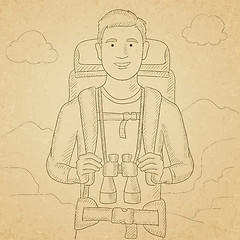 Image showing Cheerful backpacker with binoculars.