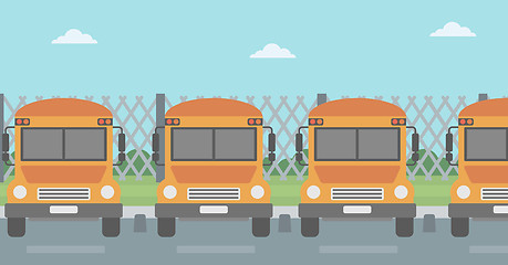 Image showing Yellow buses on the background of mesh fence.