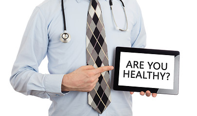 Image showing Doctor holding tablet - Are you healthy?