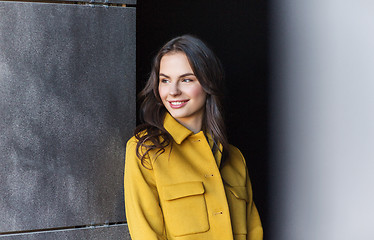 Image showing smiling young woman in city