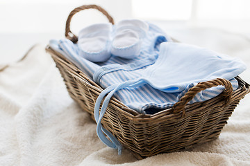 Image showing close up of baby clothes for newborn boy in basket