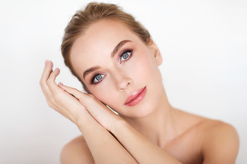 Image showing beautiful young woman face and hands