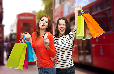 Image showing teenage girls with shopping bags and credit card