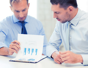 Image showing businessmen with notebook on meeting