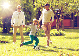 Image showing happy family playing football outdoors