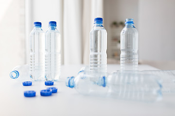 Image showing close up of bottles with drinking water on table